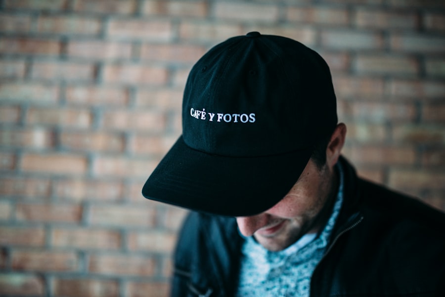 Close-up of embroidered detail on a black fitted cap